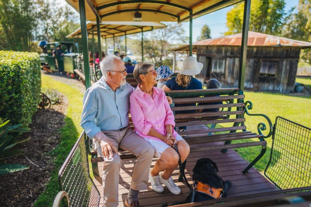 "Couple riding the little train at the Ginger Factory, Yandina