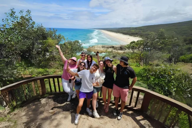 548d8cbfd8df4bd49ad88043e4a70448hero_6_lg Group of travellers at North Gorge Walk with North Stradbroke Island beach backdrop