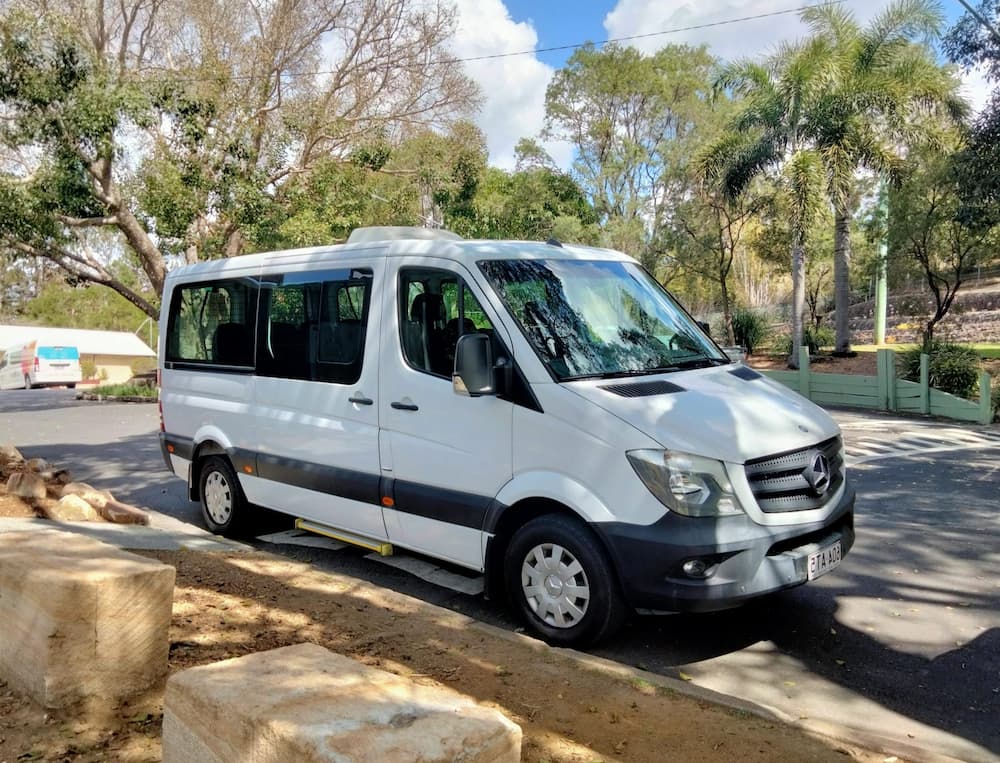 Adventure Day Trips minivan parked outdoors ready for a tour