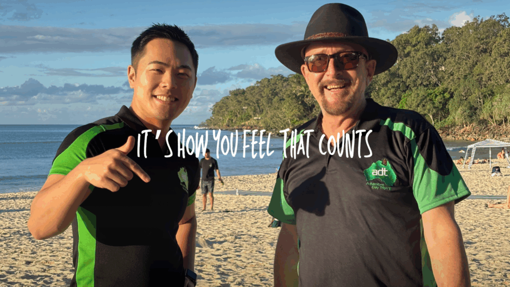 Brisbane day tour guides from Adventure Day Trips with guests at the beach Queensland