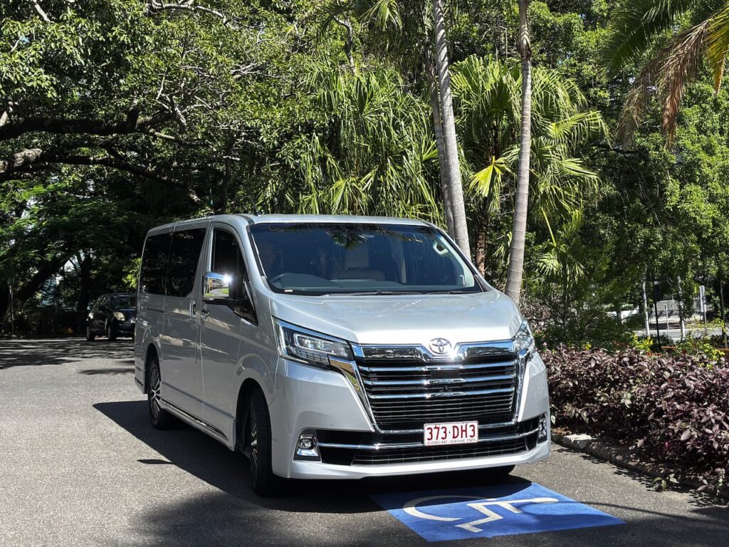 Adventure Day Trips private tour vehicle parked under palm trees