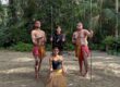Visitors with Aboriginal performers during a cultural experience at Currumbin Wildlife Sanctuary