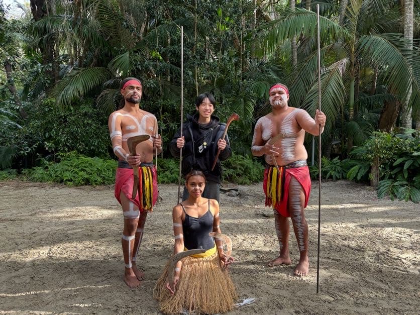 Visitors with Aboriginal performers during a cultural experience at Currumbin Wildlife Sanctuary